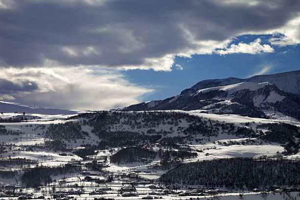 istock Winter mountains and village at evening 509192698