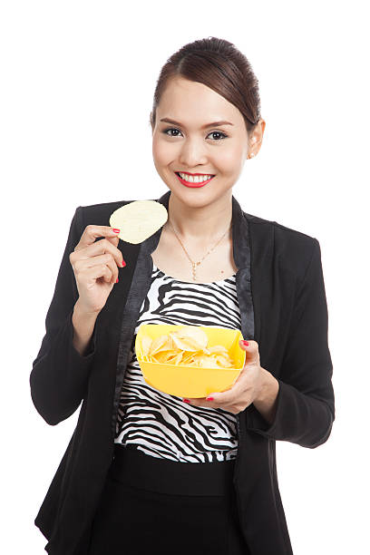 istock Young Asian woman eat potato chips 509193768