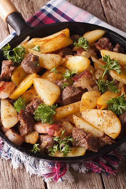 istock fried potatoes with meat and bacon served in pan close-up 509193994