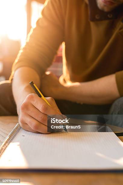 Man Erasing Notes Unrecognizable Man Taking Notes In A Textbook Stock Photo - Download ...