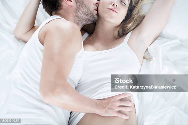 Man Touching Softly His Wife Stock Photo - Download Image Now - Kissing, Adult, Adults Only