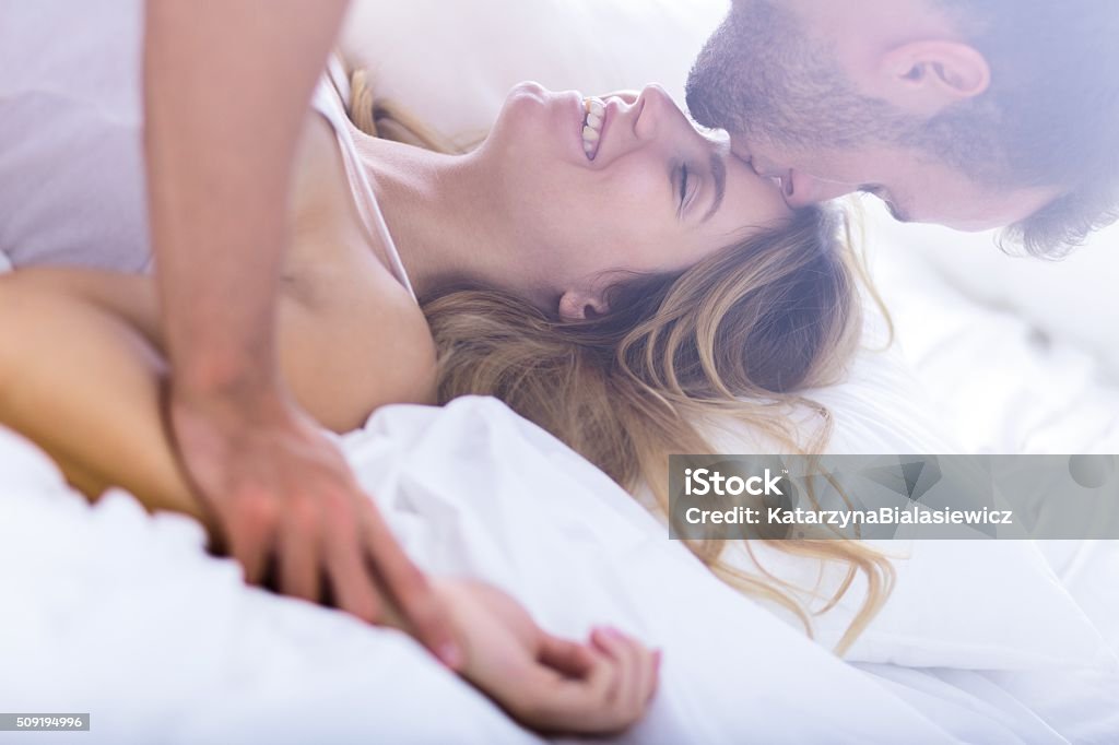 Young marriage during morning sex Young passionate married couple during morning sex Orgasm Stock Photo