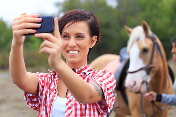 istock Young rider make selfie with her horse 509197064