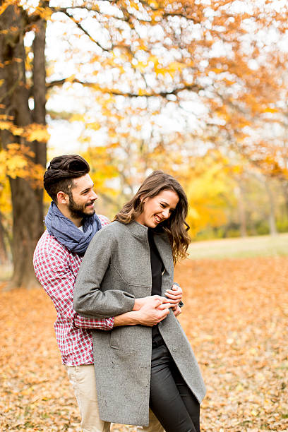 istock Young couple in the autumn park 509198310