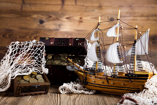 istock pirate ship, chests of gold 509206639
