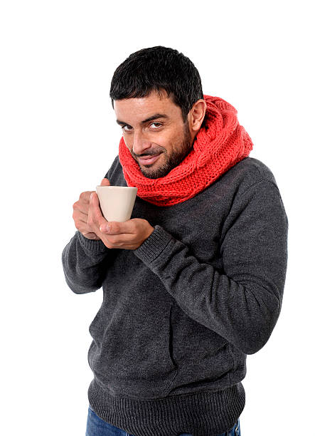 istock attractive man drinking cup of coffee tea in winter 509210817