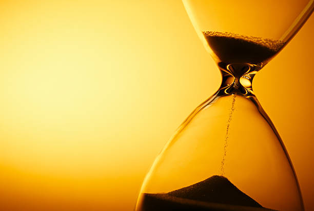 istock Sand passing through the bulbs of an hourglass 509211483