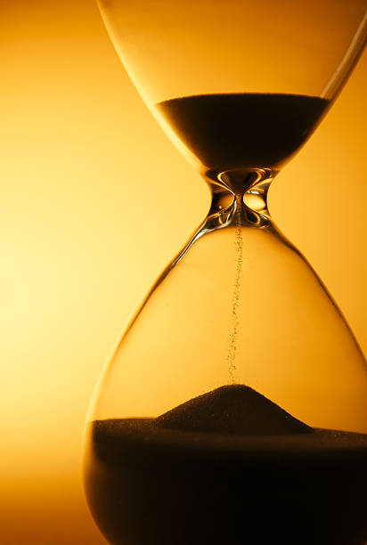 istock Sand passing through the bulbs of an hourglass 509211485