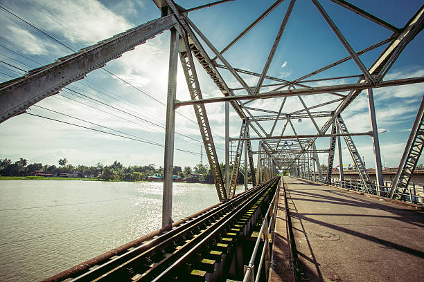 istock Railroad bridge with symmetrical metal structure and tracks. 509225502