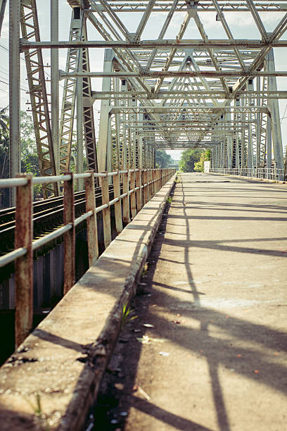 istock Railroad bridge with symmetrical metal structure and tracks. 509226842
