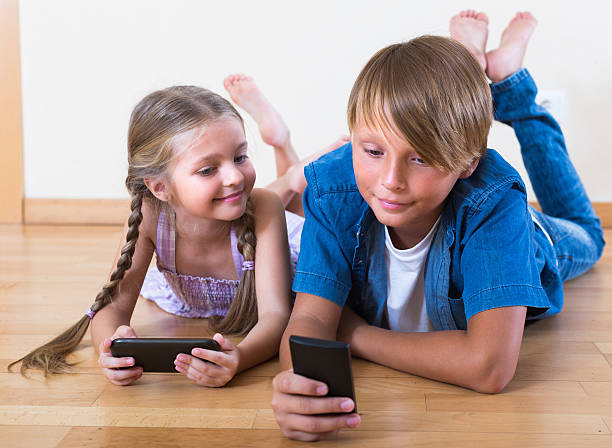 istock Children burying in mobile phones 509228334