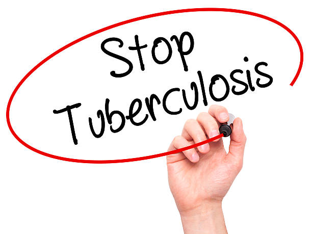istock Man Hand writing Stop Tuberculosis with black marker 509231332