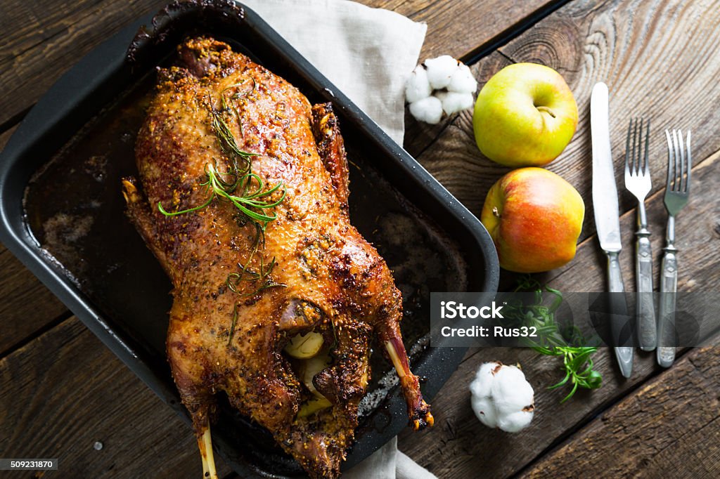 Roasted goose with apples in a rustic style Apple - Fruit Stock Photo