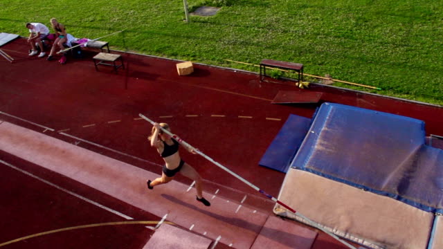 HD:Super Slo-Mo Shot of Young Women at Pole Vault