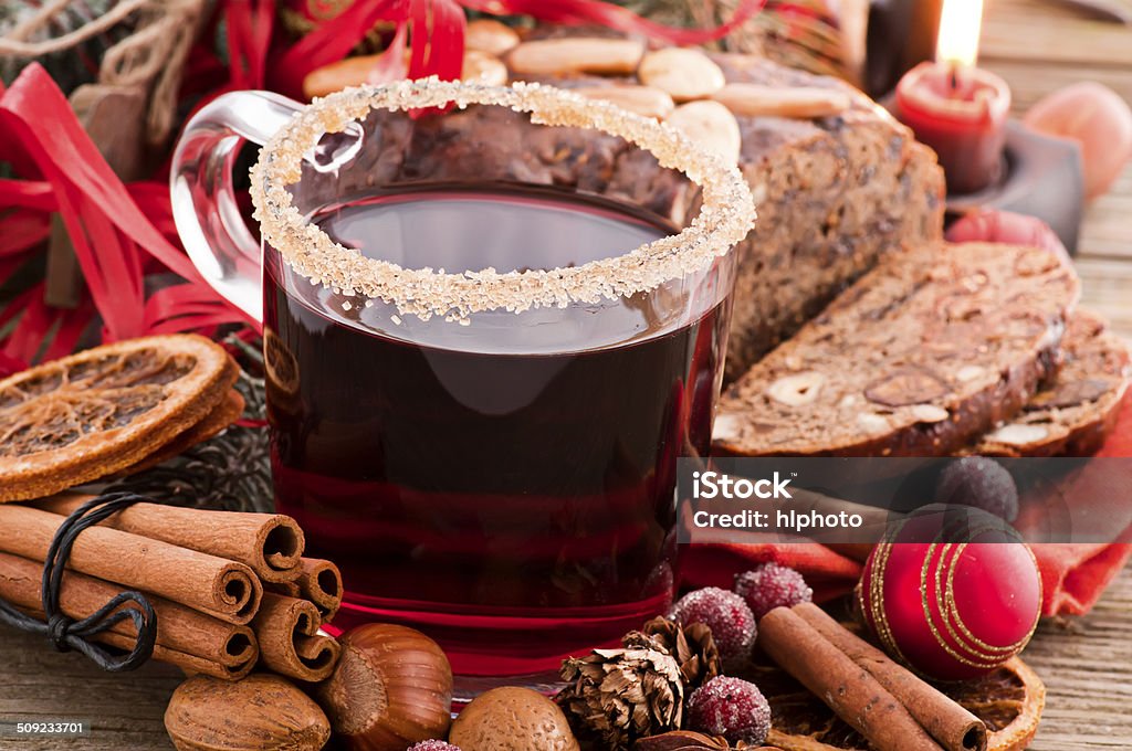 Hot Wine Hot wine with Christmas decoration as closeup on a wooden board Advent Stock Photo