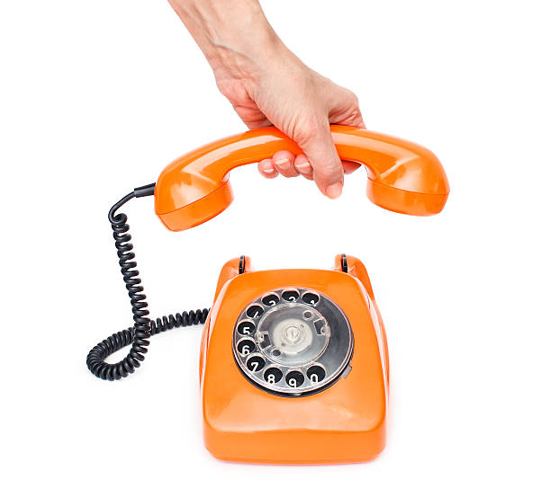 Orange retro telephone isolated on white background. stock photo