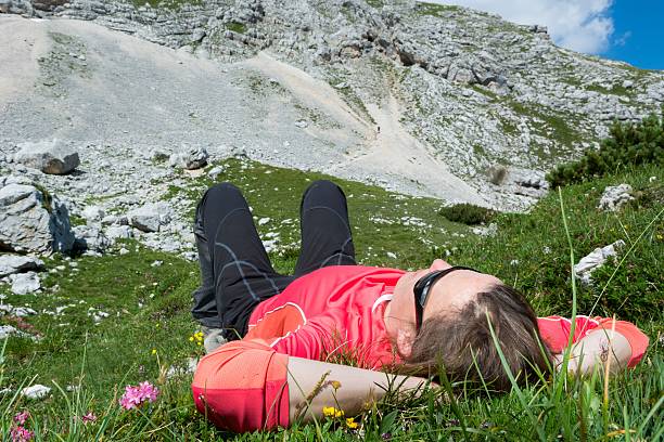 istock Young woman relaxing in a mountain meadow 509234337