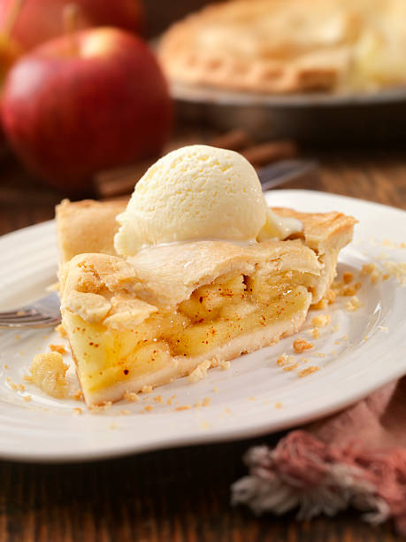Apple Pie with Vanilla Ice Cream Apple Pie with Vanilla Ice Cream -Photographed on Hasselblad H3D2-39mb Camera apple pie a la mode stock pictures, royalty-free photos & images