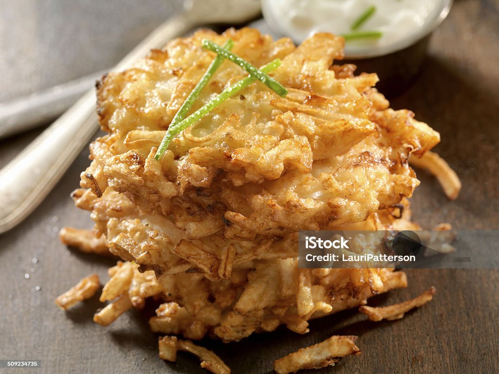 Potato Pancakes Potato Pancakes, Latkes with Sour Cream and Chives -Photographed on Hasselblad H1-22mb Camera Hanukkah Stock Photo