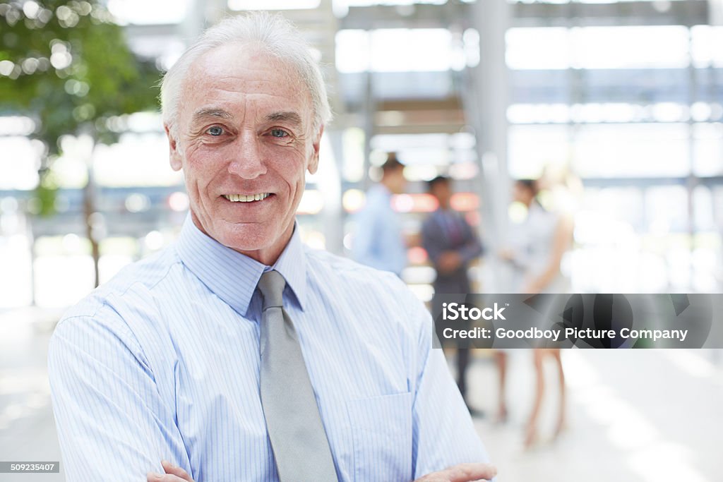Building an empire and a legacy in business Portrait of a mature businessman standing indoors 60-69 Years Stock Photo