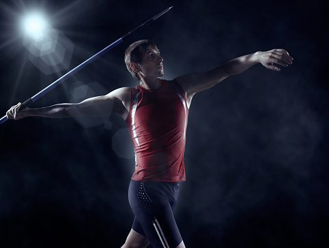 Athlete competes in javelin throwing. About 25 years old, Caucasian male.