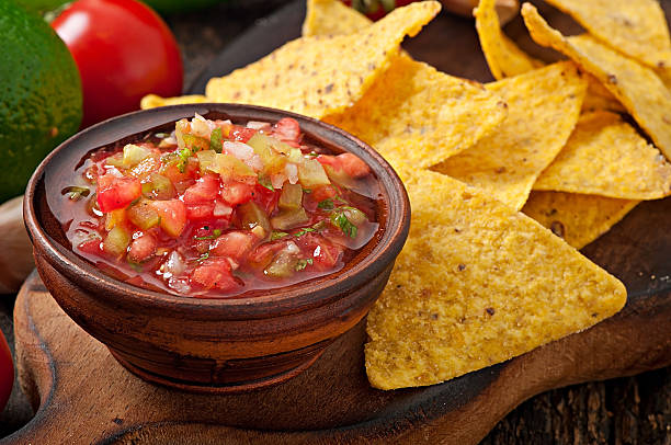 istock Mexican nacho chips and salsa dip in bowl 509235911