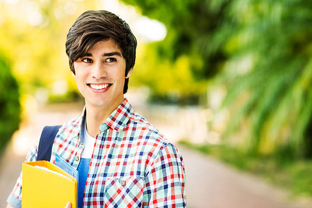 istock Male Student With Files Looking Away On College Campus 509236113