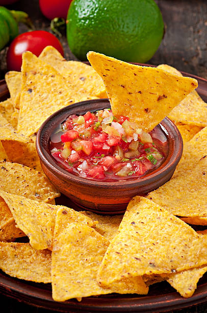 istock Mexican nacho chips and salsa dip in bowl 509236153