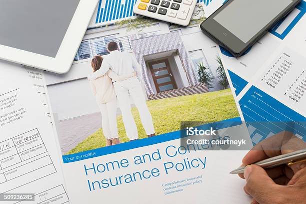 Home And Contents Insurance Document With Paperwork Stock Photo - Download Image Now