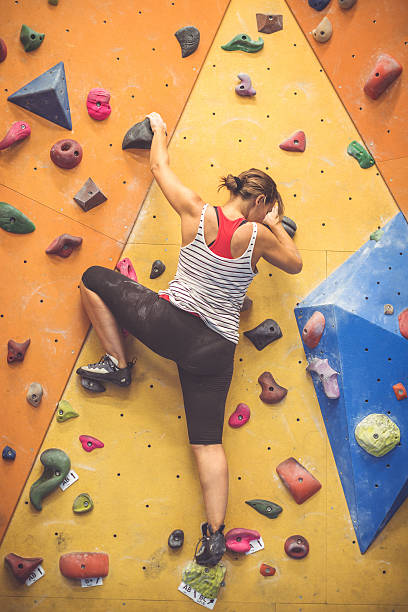 istock Woman climbing and bouldering indoor 509237442