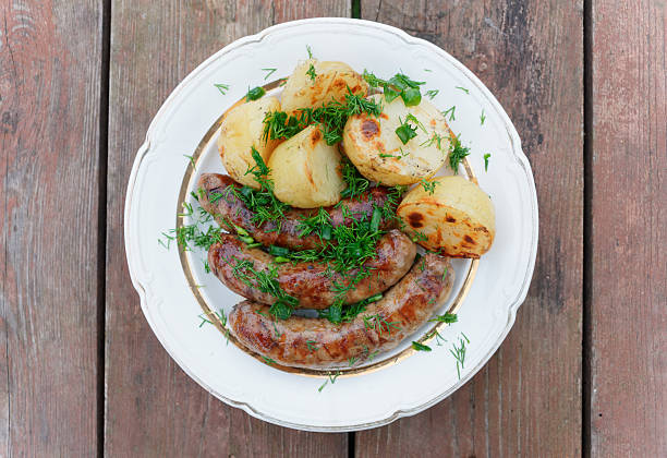 istock Grilled sausages and potatoes 509237749