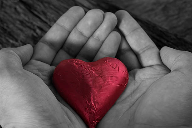 istock valentines day concept. holding a red heart in hands. 509237828
