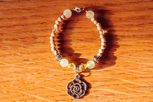 Bracelet with rose pendant and jadeite mineral gem stone