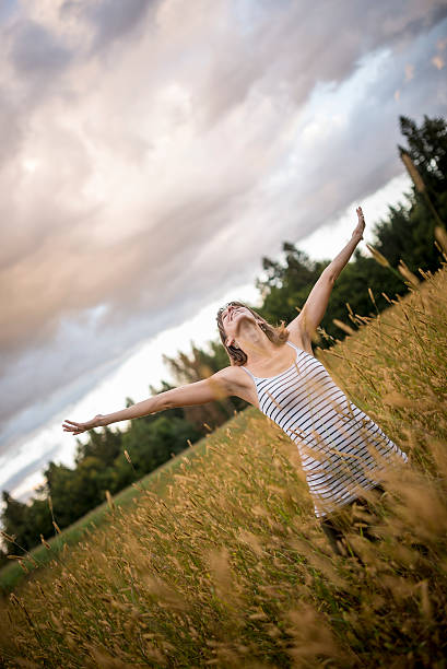 istock Happy young woman celebrating a beautiful life 509238528