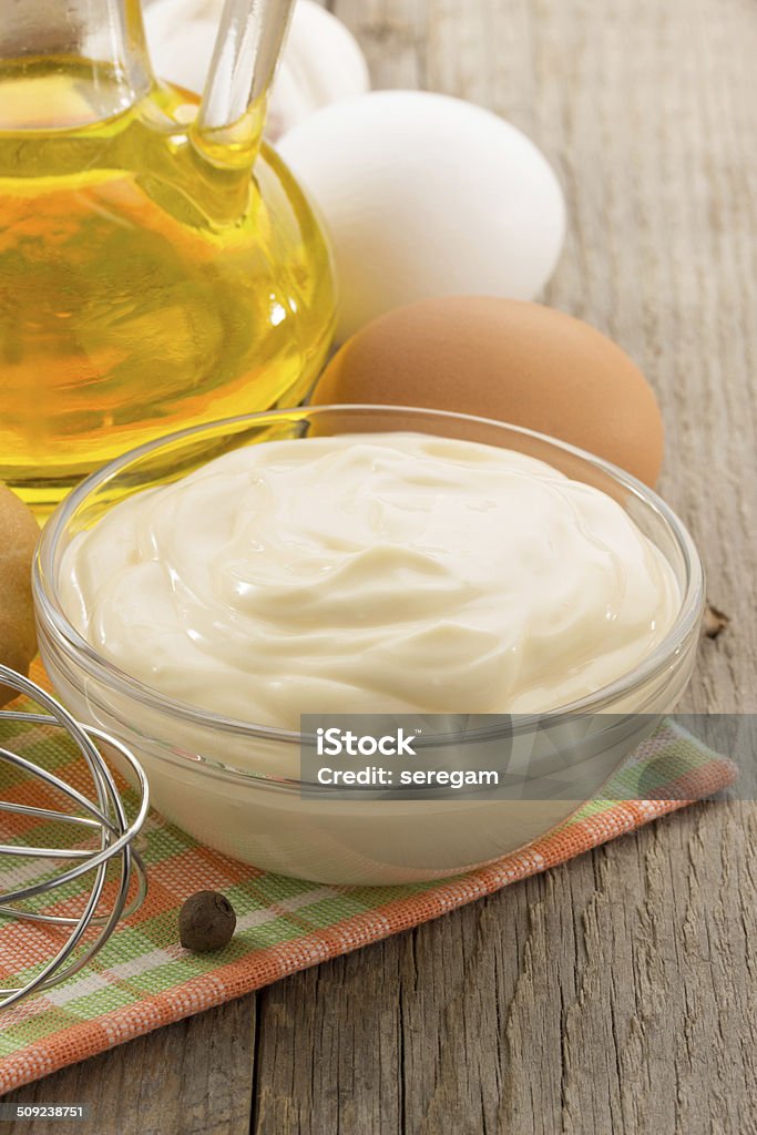 mayonnaise sauce in bowl on wood mayonnaise sauce in bowl on wooden background Bowl Stock Photo