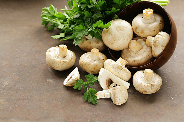 istock natural organic raw mushrooms champignons on table 509241428