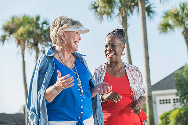 istock Two senior women walking and talking outdoors 509242488