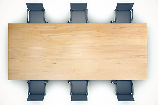 istock Top view on conference wooden table and black chairs 509242640