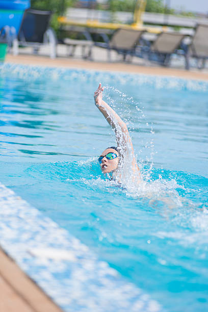 istock Woman in goggles swimming front crawl style 509244182