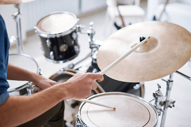 Hitting on drums Close-up of male hand hitting drums with sticks snare drum photos stock pictures, royalty-free photos & images
