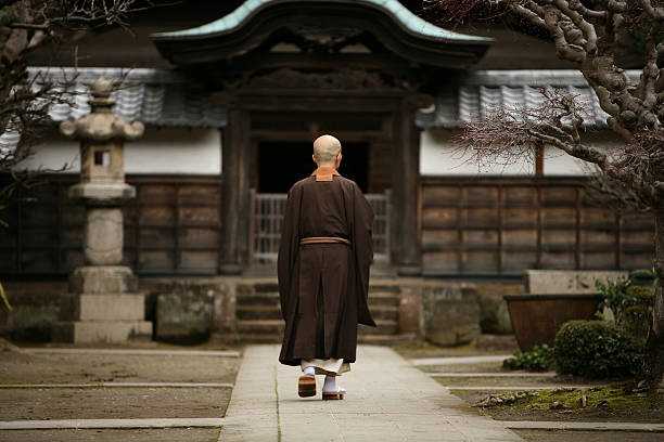 Buddhist monk in Kamakura, Japan. Kamakura, Japan - March 23, 2009: The buddhist monk in courtyard of a monastery in Kamakura, Japan. kamakura city photos stock pictures, royalty-free photos & images