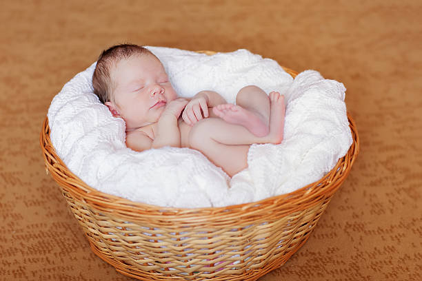 istock Caucasian newborn baby while sleeping closeup 509247138