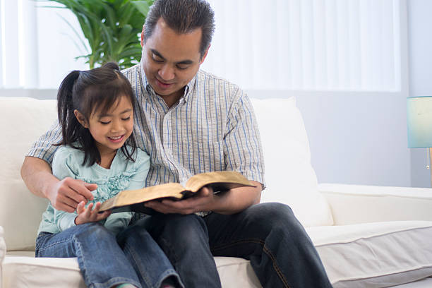 istock Father Reading to His Daughter 509247256