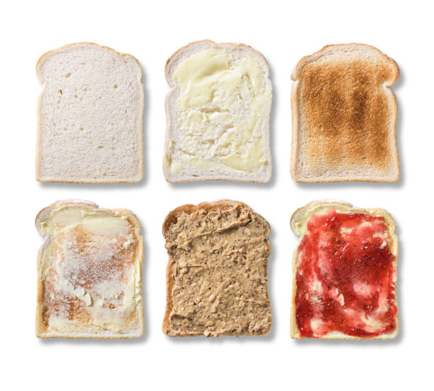 istock Overhead white bread, toast, butter, jam and peanut butter isola 509247876