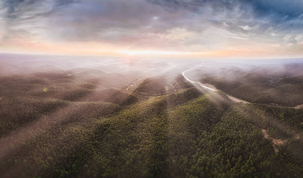Ambient Sunrise fog and light streaming across moutains appalachian mountains stock pictures, royalty-free photos & images