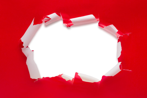 This is a photo of a ripped open red present.