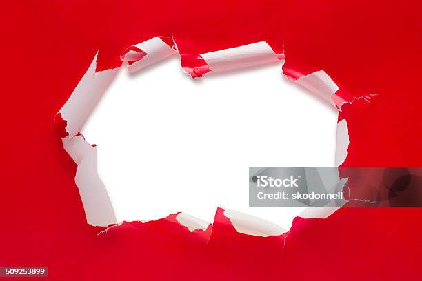 Christmas Present Torn Open Stock Photo - Download Image Now - Wrapping Paper, Torn, Gift