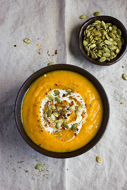istock pumpkin soup with pumpkin seeds  on a bowl 509254440
