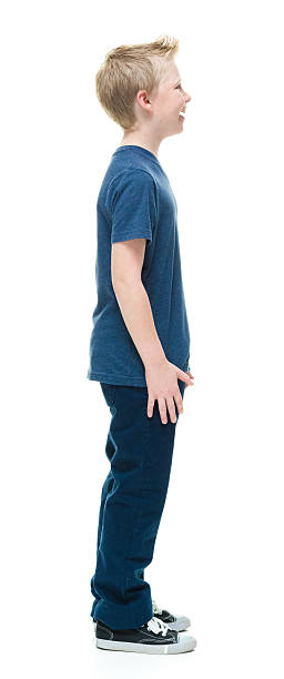 istock Smiling little boy standing and looking away 509254498