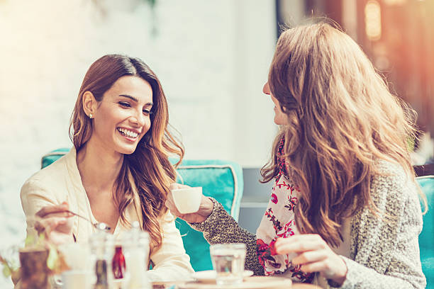 istock Young women friends drinking tea and coffee 509254818